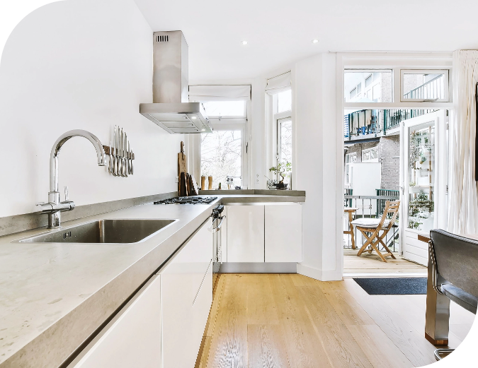 light-interior-kitchen-with-gray-counter-open-doorway-leading-cozy-balcony-apartment-building