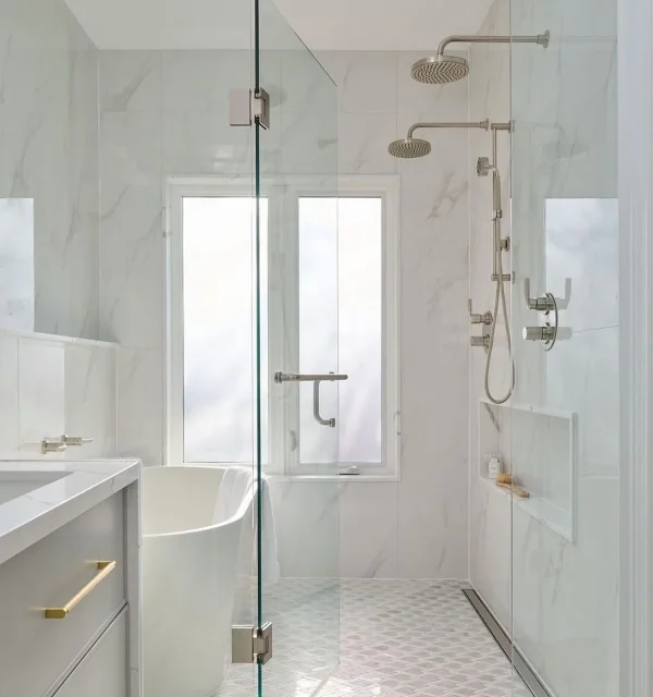 Bright marble bathroom with rubinet glass shower and double heads